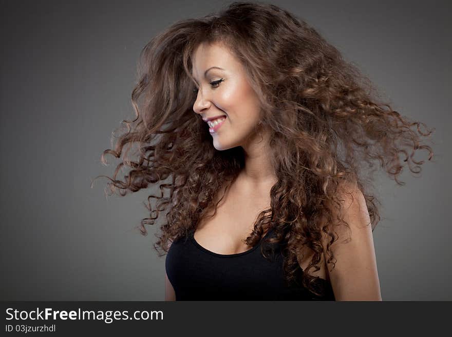 Portrait of smiling woman with curly hair