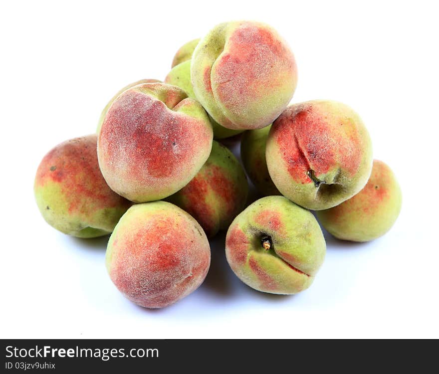 Ripe apricots over white background.