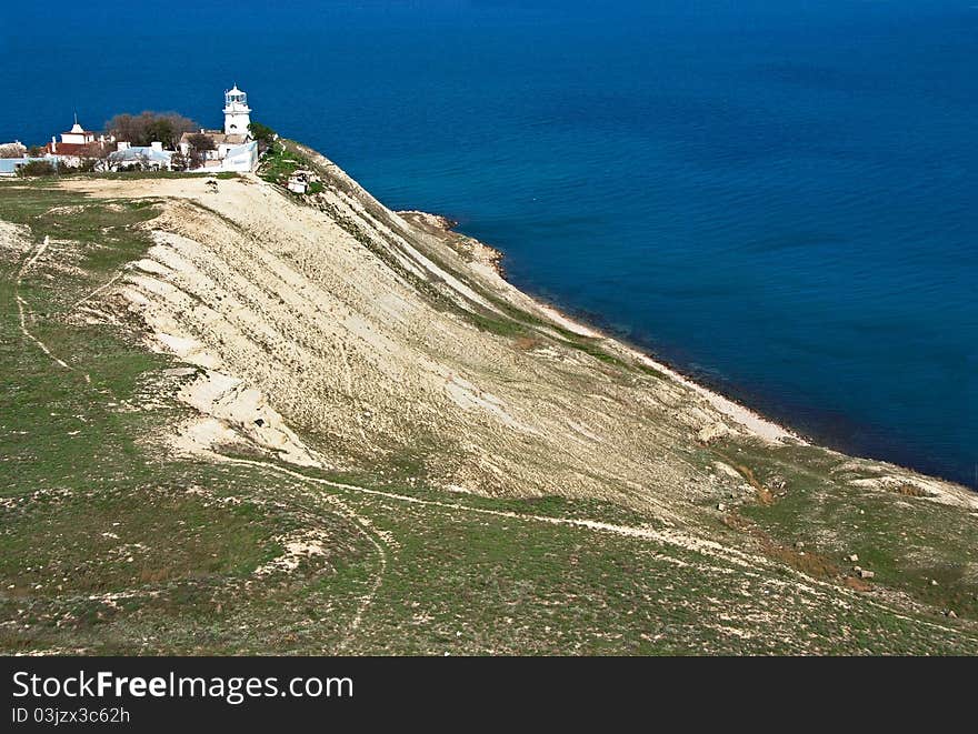 White lighthouse on sea coast