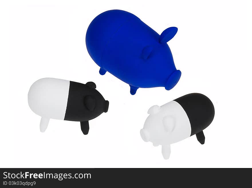 Three toy pigs isolated on white