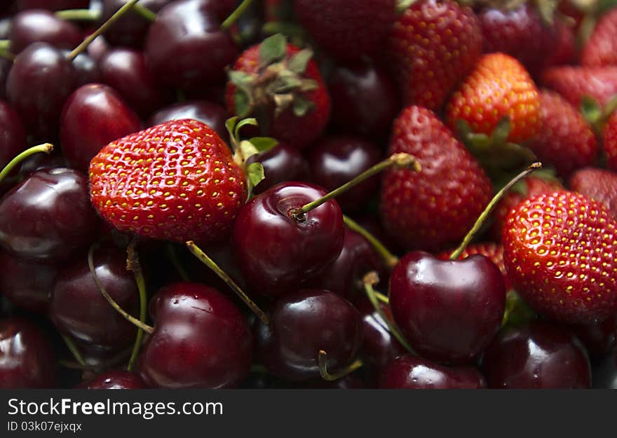 Selection of ripe berries - cherry and strawberry. Selection of ripe berries - cherry and strawberry