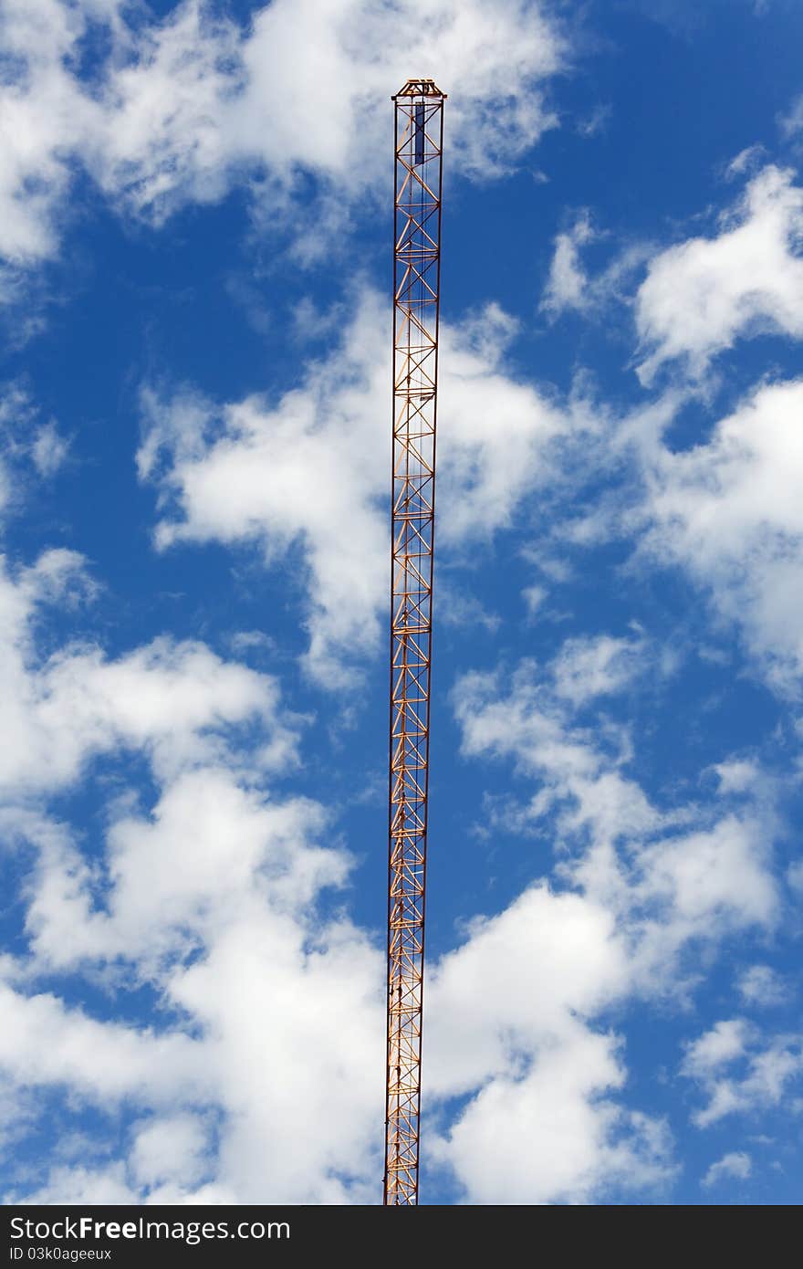 Crane Against The Cloudy Sky