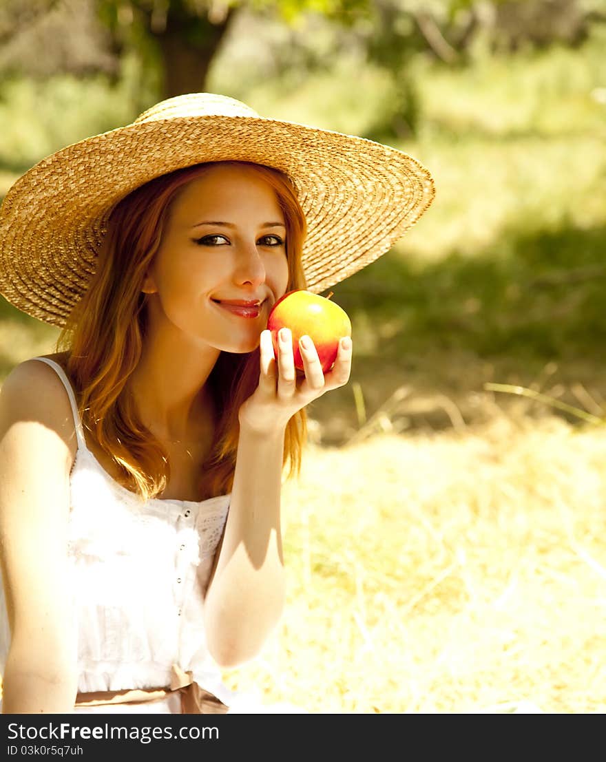 Redhead Girl With Fruit At Garden.