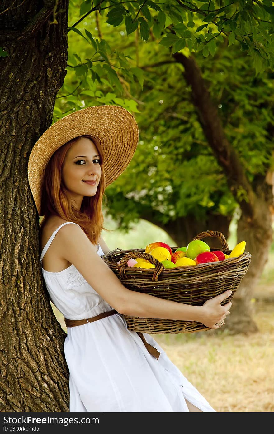 Redhead Girl With Fruit At Garden.