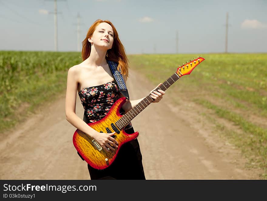 Girl With Guitar At Countryside.