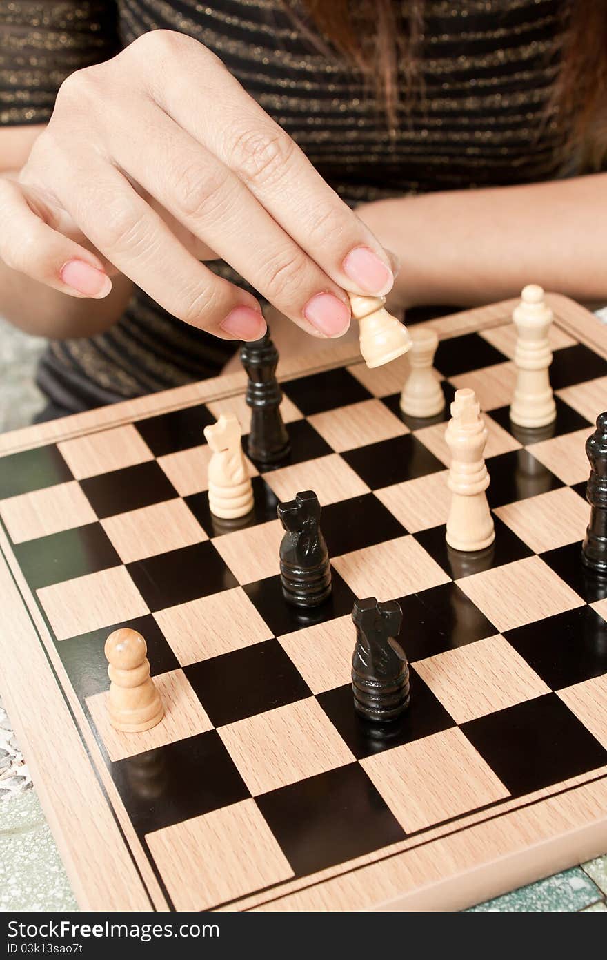 Women playing chess at outdoor