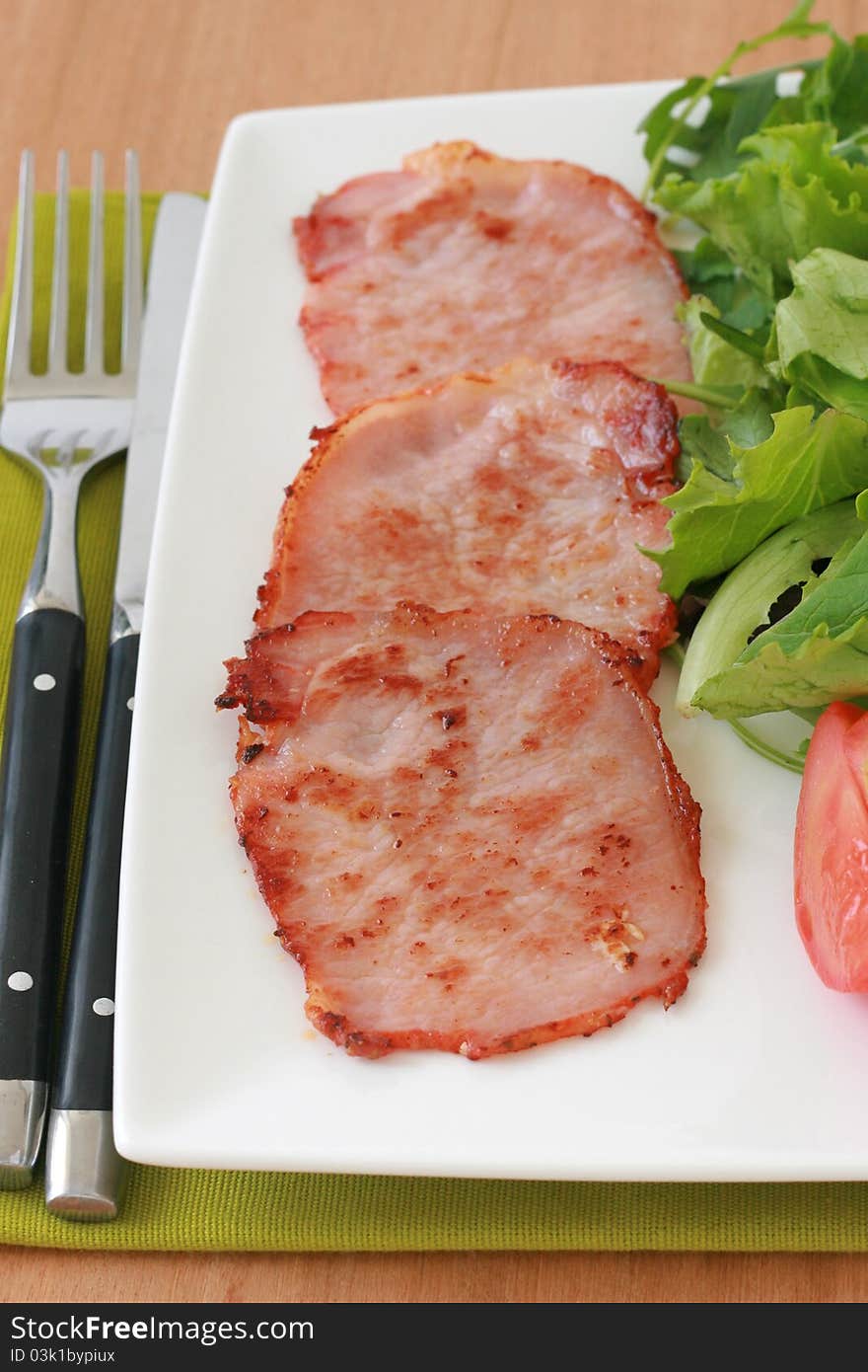 Fried pork with salad