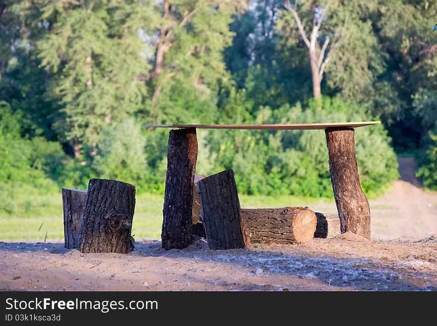 Handmade table made of logs on the nature