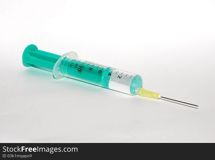 Great view of a syringe filled with medicine prepared for vaccination. Great view of a syringe filled with medicine prepared for vaccination