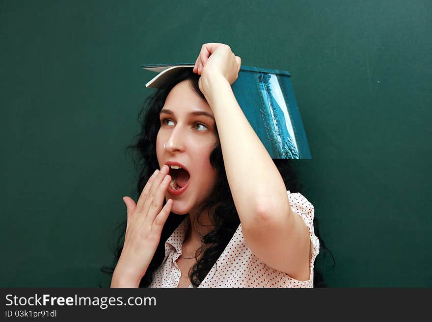 Girl at the lesson near blackboard. Girl at the lesson near blackboard