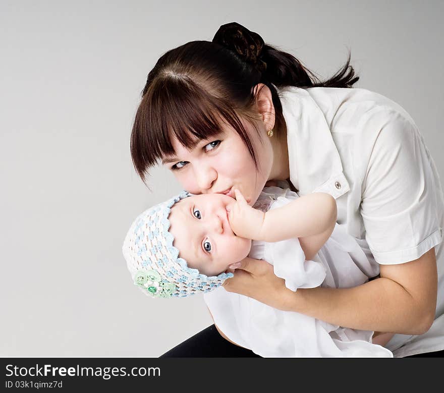 Mother kisses the daughter