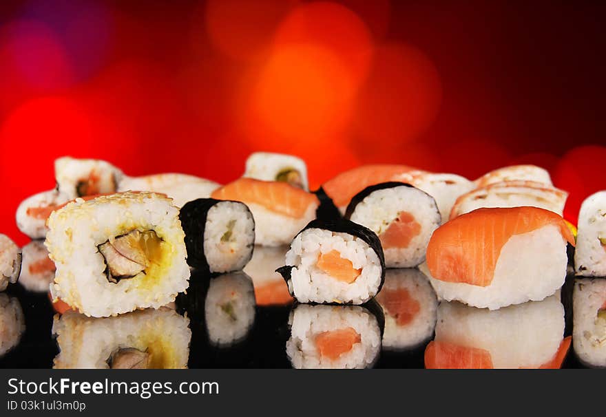 Delicious sushi food on shiny blur background