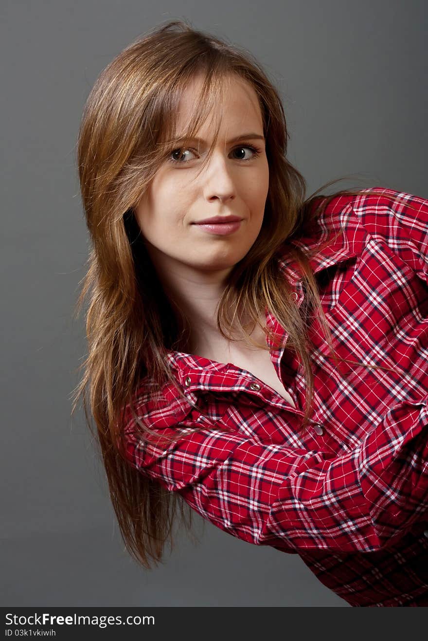 Playful girl with long hair in red shirt. Playful girl with long hair in red shirt