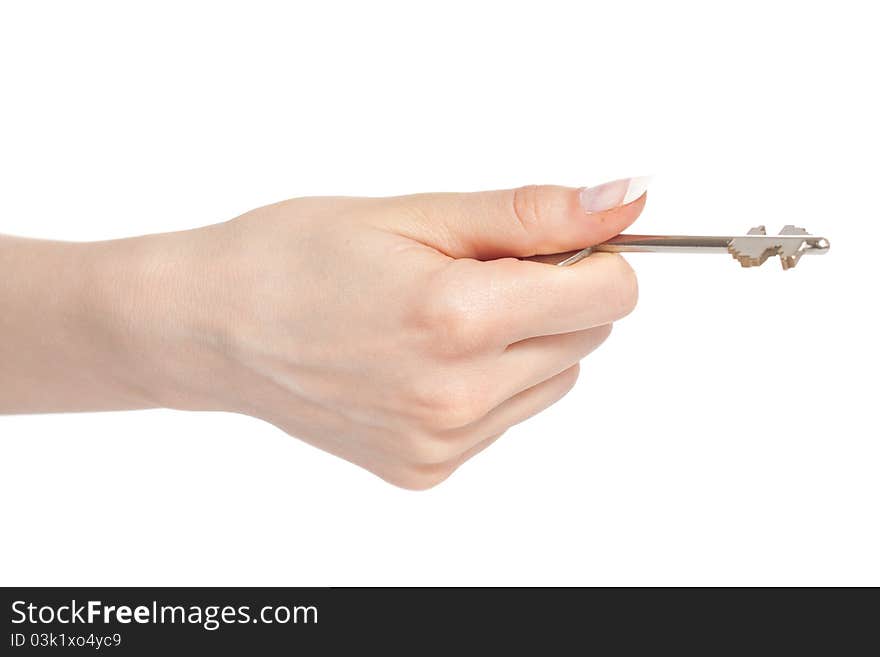 Woman hand holding key before opening door isolated on white background. Woman hand holding key before opening door isolated on white background