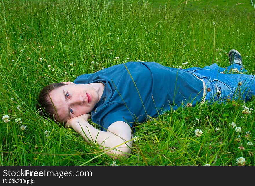 The Young Man Lies On Green Meadow