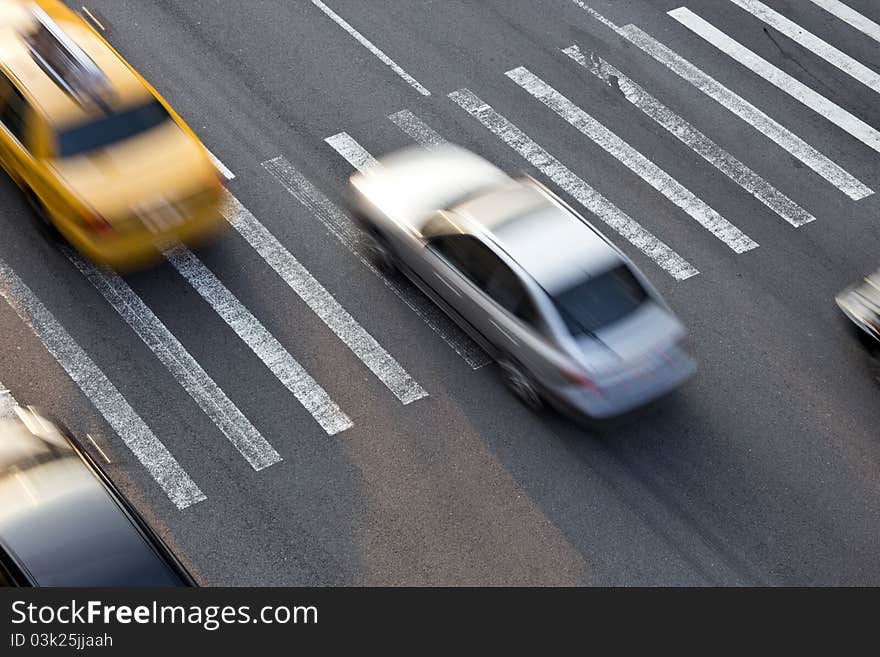 Traffic of New York traversing a zebra crossing. Traffic of New York traversing a zebra crossing