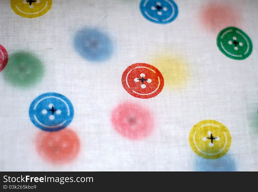 Colorful fastener on the white cloth