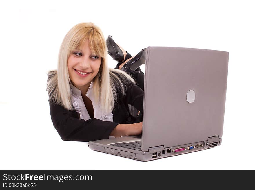 Young woman lying and looking at laptop