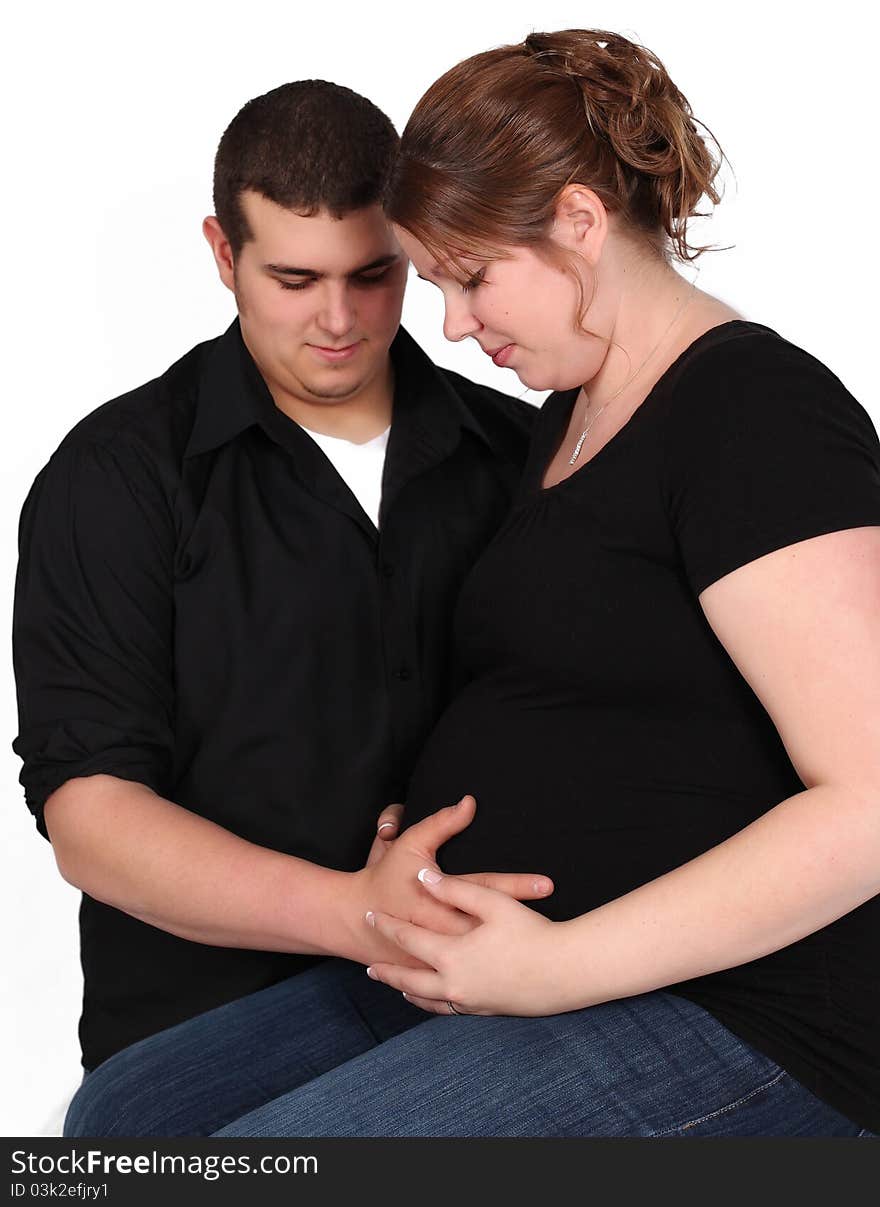 Couple Holding Woman S Pregnant Stomach. Isolated