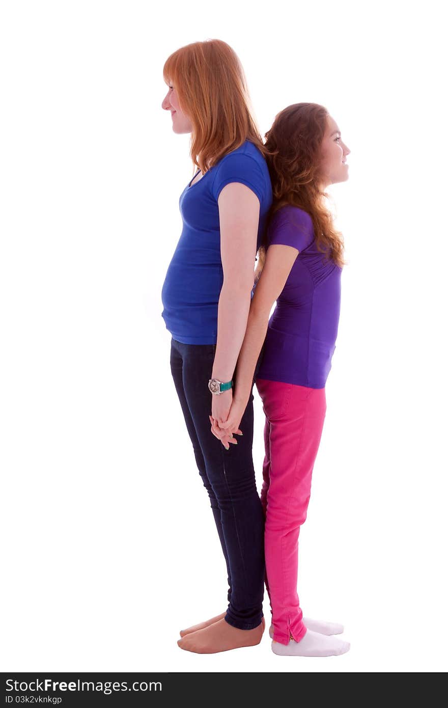 Two young friends standing at close quarters. Two young friends standing at close quarters