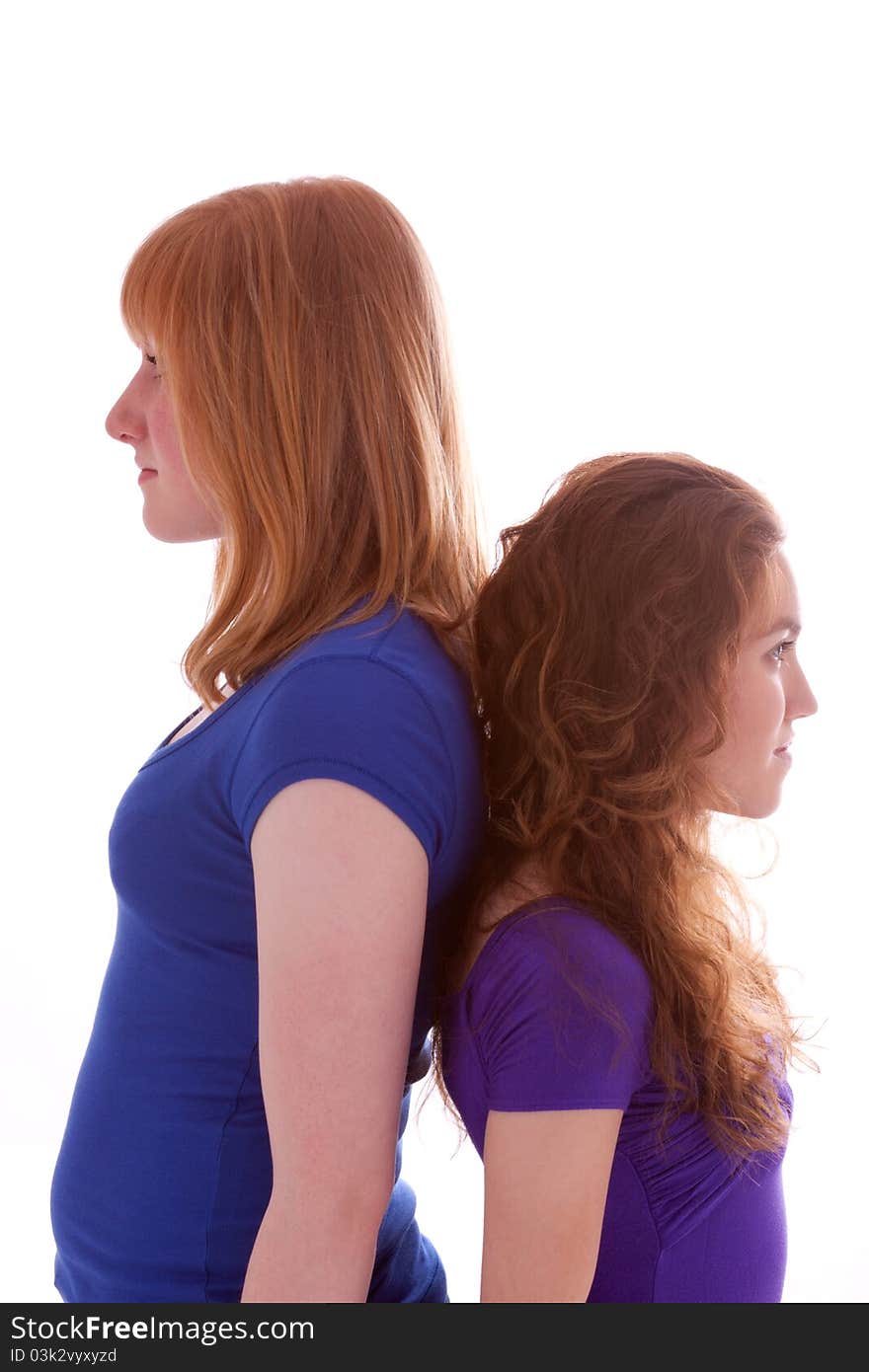 Two young friends standing at close quarters. Two young friends standing at close quarters