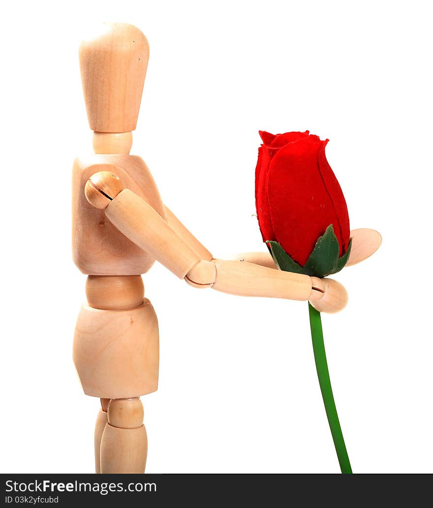 Wooden manniquin holding red rose over white background. Wooden manniquin holding red rose over white background.