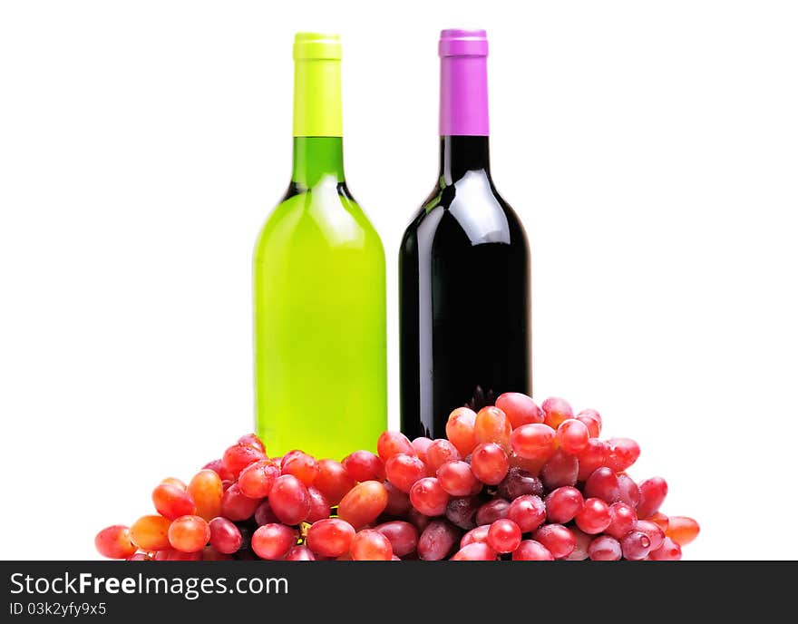 Two bottles of wine and the red grape isolated over white