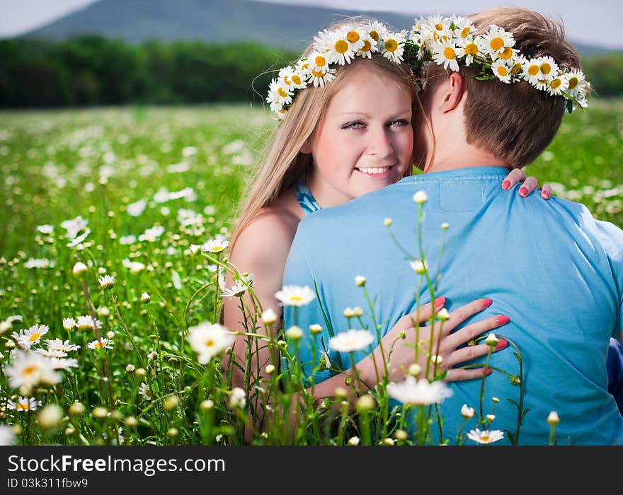 Pretty young couple in the fields