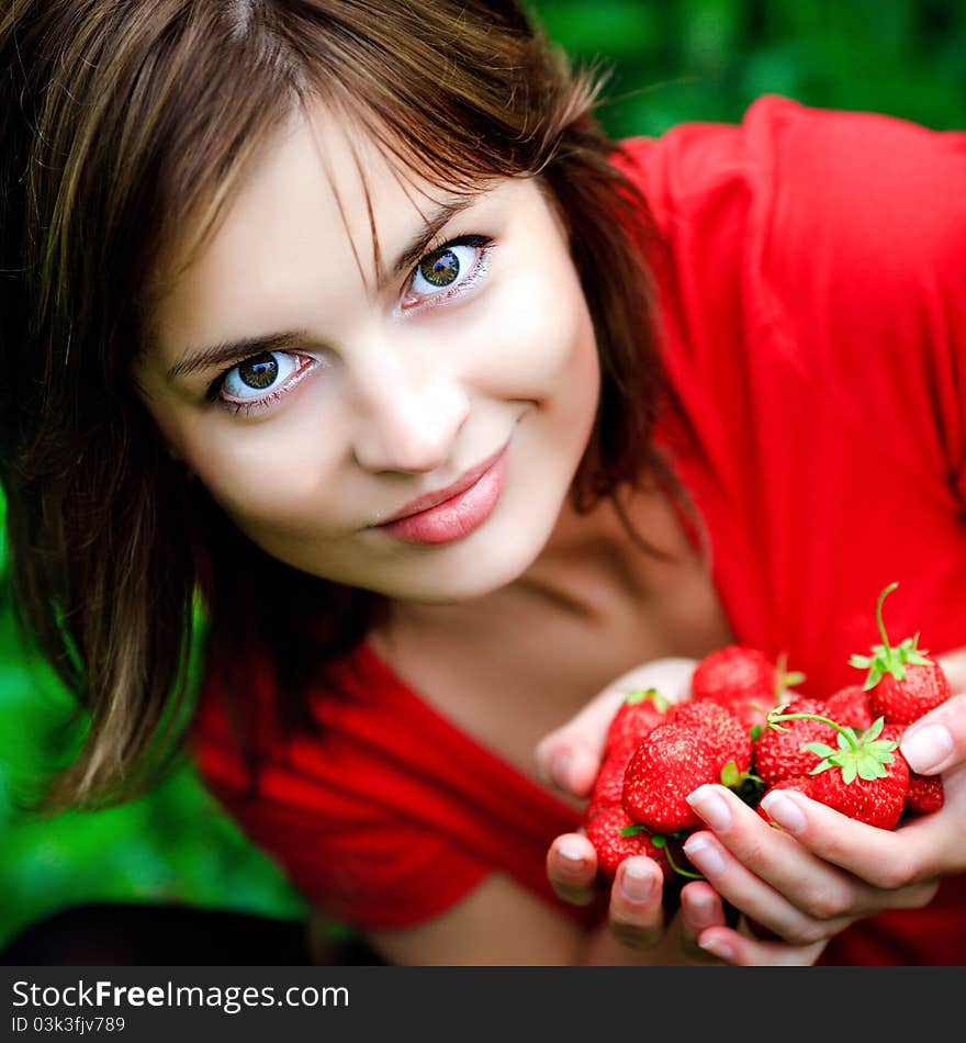 Sweet red strawberry in beautiful woman hands. Sweet red strawberry in beautiful woman hands