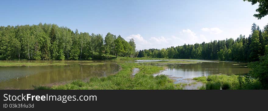 View down the valley of the river in sunny summer