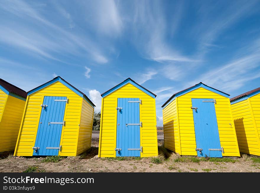 Yellow beach huts in summer