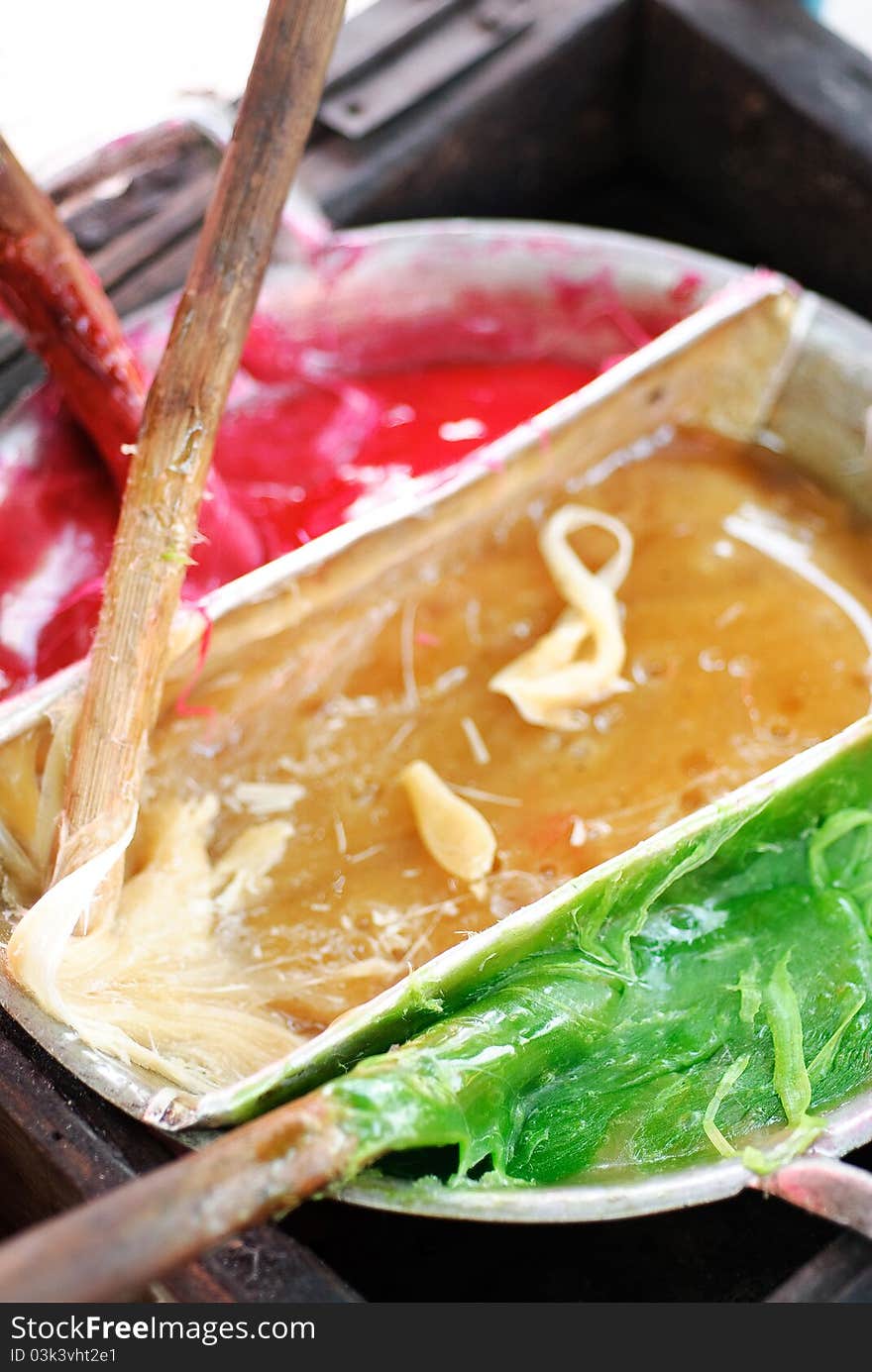 Thai colorful sweetmeat on the boiled pan.