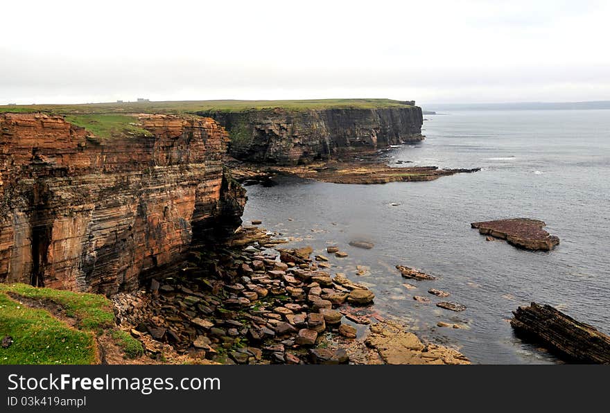 Island of Stroma Coastline, Caithness, Scotland, UK The Island of Stroma or Stroma, is an island off the northern coast of the mainland of Scotland. It is the most southerly of the islands in the Pentland Firth between the Orkney Islands and Caithness, the northeasternmost part of the mainland. Stroma is part of the county of Caithness. The name is from the Old Norse Straumr-øy meaning &#x22;island in the [tidal] stream&#x22;. Ancient stone structures testify to the presence of Stroma&#x27;s earliest residents, while a Norse presence around 900–1,000 years ago is recorded in the Orkneyinga Saga. It has been politically united with Caithness since at least the 15th century. Although Stroma lies only a few miles off the Scottish coast, the savage weather and ferociously strong tides of the Pentland Firth meant that the island&#x27;s inhabitants were very isolated, causing them to be largely self-sufficient, trading agricultural produce and fish with the mainlanders. Most of the islanders were fishermen and crofters; some also worked as maritime pilots to guide vessels through the treacherous waters of the Pentland Firth. The tides and currents meant that shipwrecks were frequent—the most recent occurring in 1993—and salvage provided an additional though often illegal supplement to the islanders&#x27; incomes. A lighthouse was built on Stroma in 1890 and still operates under automation. Stroma is now abandoned, with the houses of its former inhabitants unoccupied and