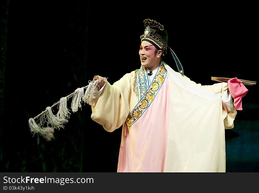 Chinese Sichuan opera performer make a show on stage. Chinese Sichuan opera performer make a show on stage.