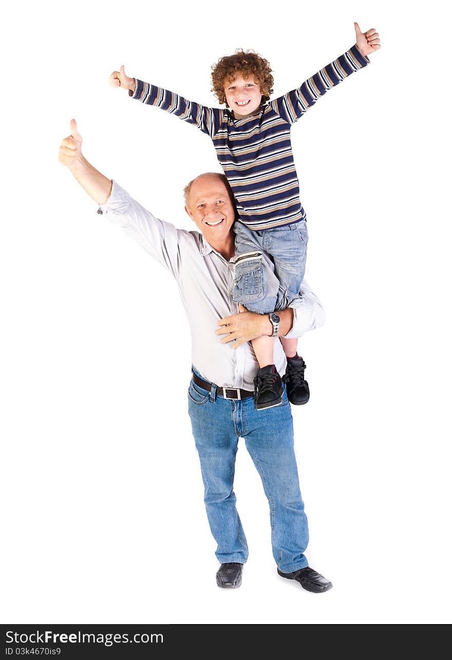 Grandfather giving grandson piggy-back against white background.