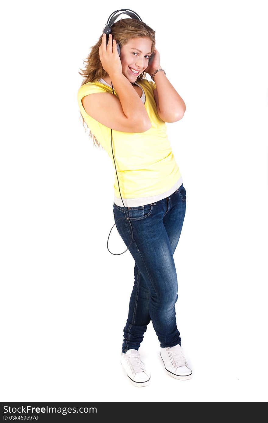 Cheerful caucasian woman listening and enjoying music, facing camera isolated on white background.