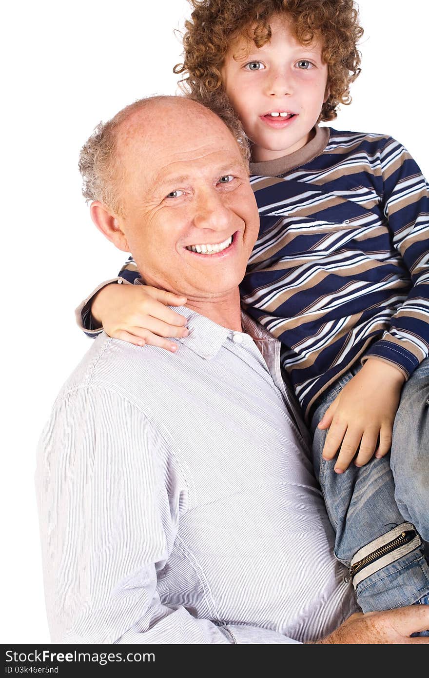 Grandfather and grandson indoors smiling. Grandfather and grandson indoors smiling.