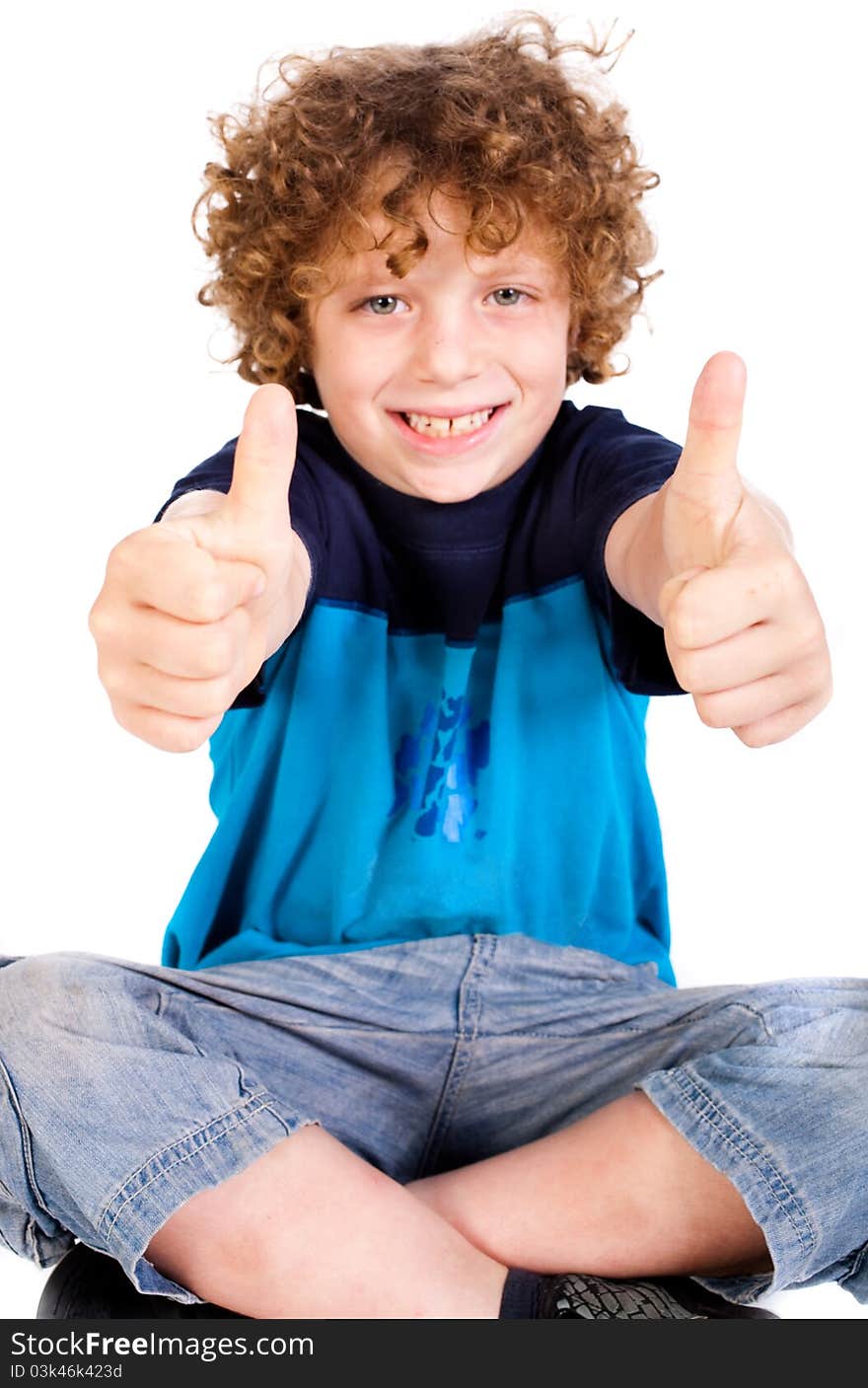 Young kid smailing at camera and showing double thumbs up isolated on white. Young kid smailing at camera and showing double thumbs up isolated on white.