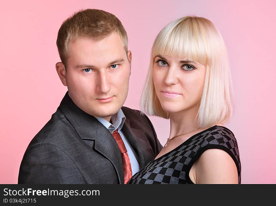 Beautiful young couple posing on a colored background. Beautiful young couple posing on a colored background