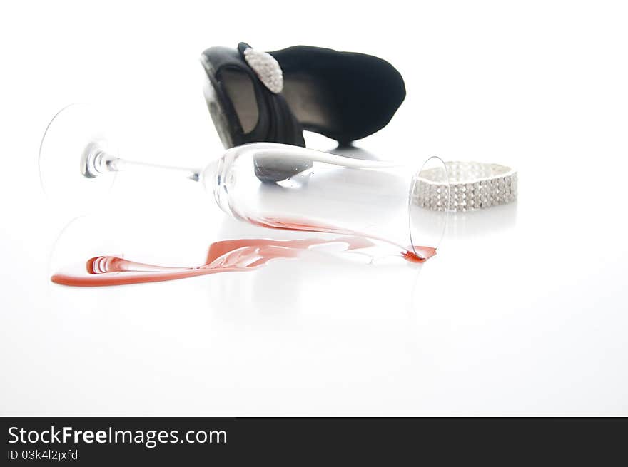 Red wine,black shoe and bracelet on white background. Red wine,black shoe and bracelet on white background