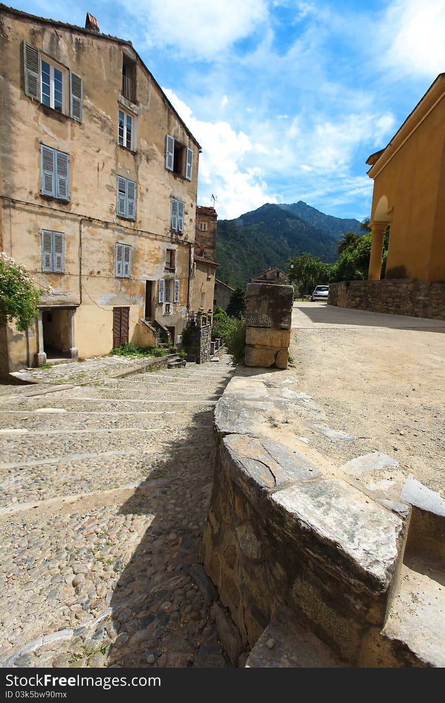 Village town square in Corsica with cobble stone street