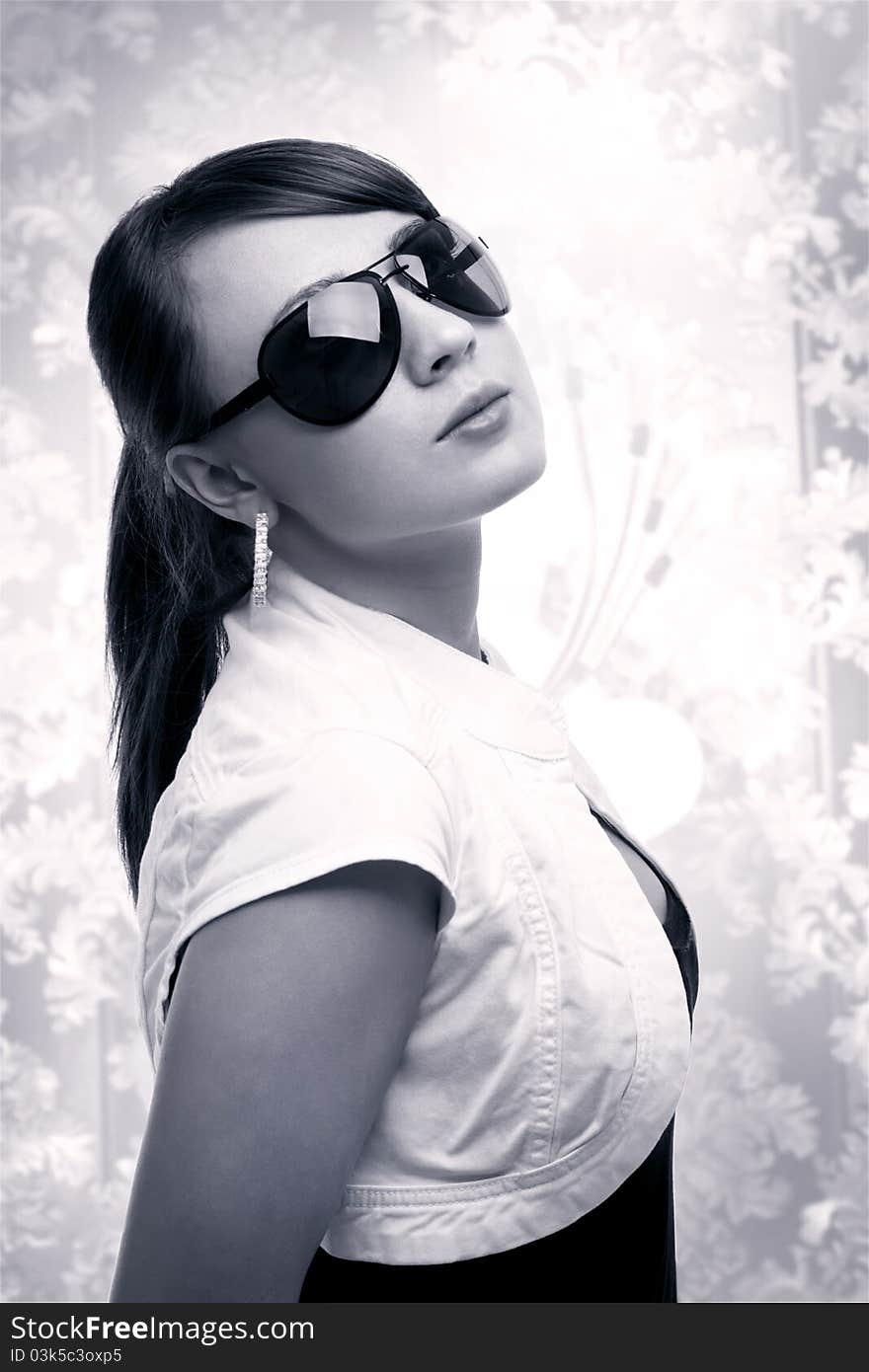 Sexy young woman wearing sunglasses