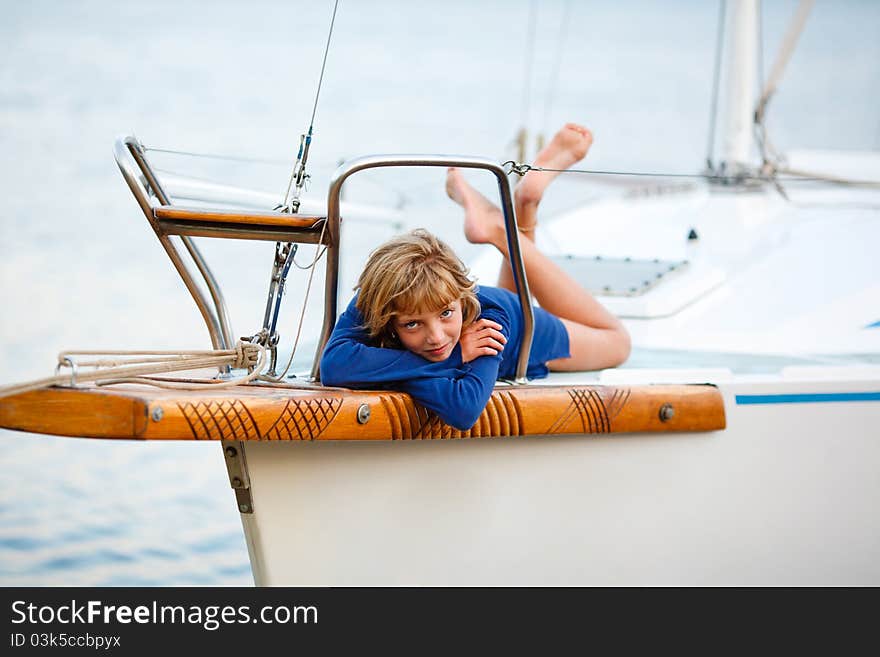 Playful pretty little girl on sail boat