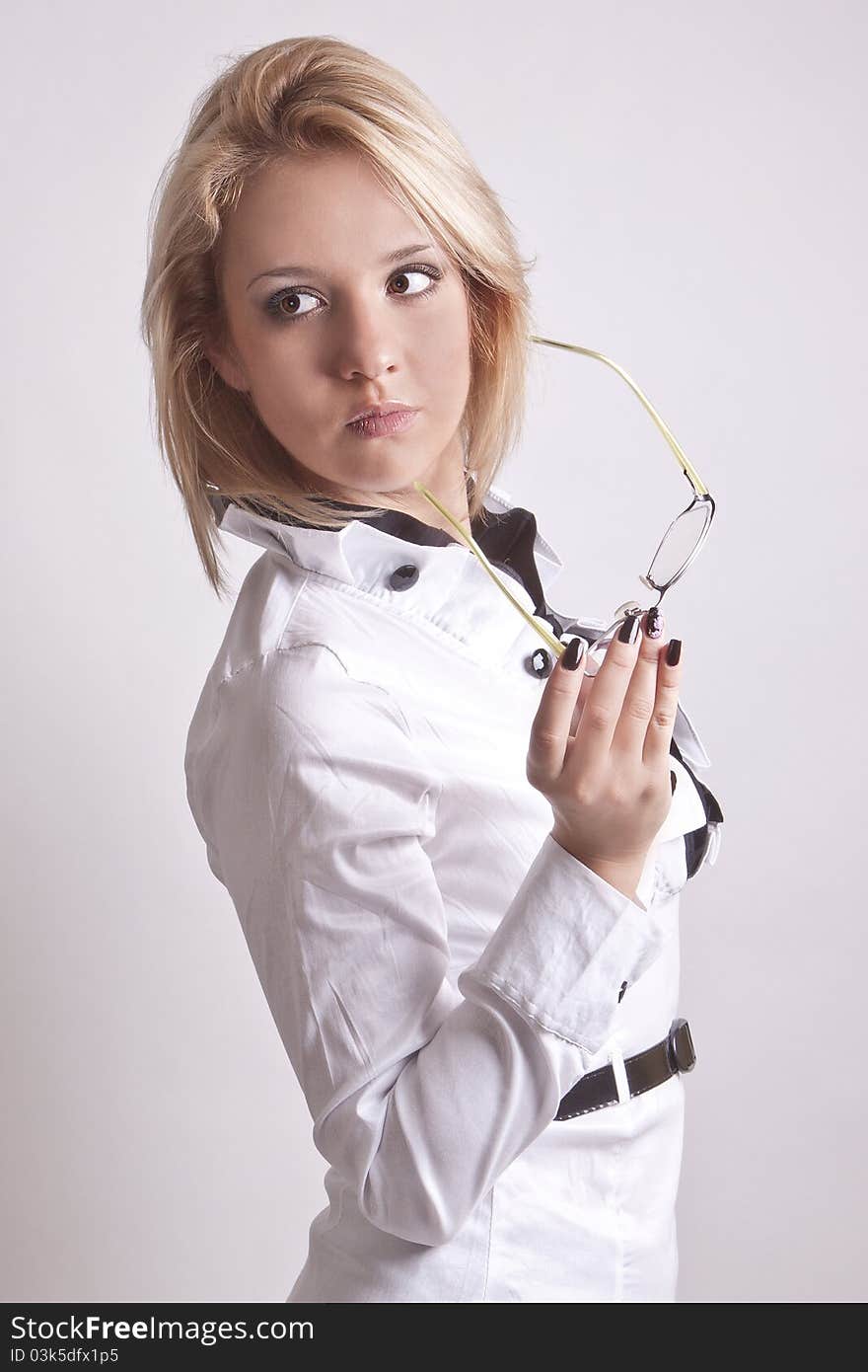 Girl in a suit and glasses