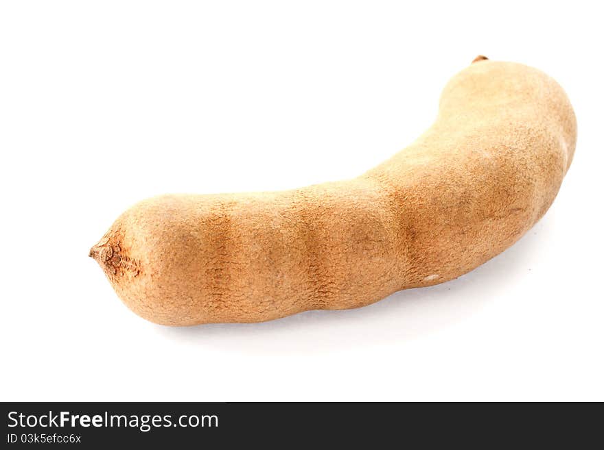 Fresh tamarind in the shell on a white background