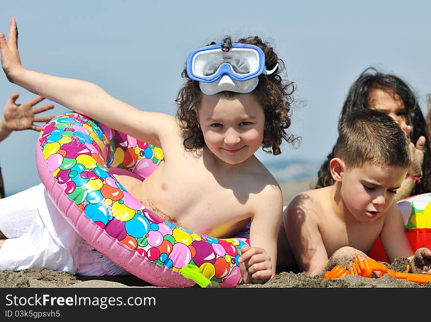 Happy child group have fun on beach while playing with toys running jumping. Happy child group have fun on beach while playing with toys running jumping