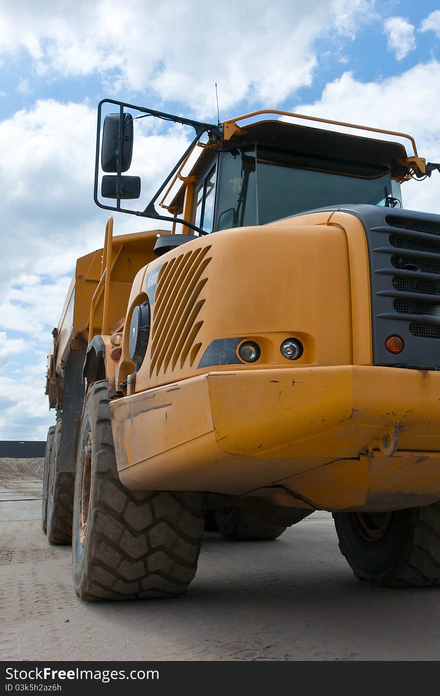 Excavation truck is loaded with sand