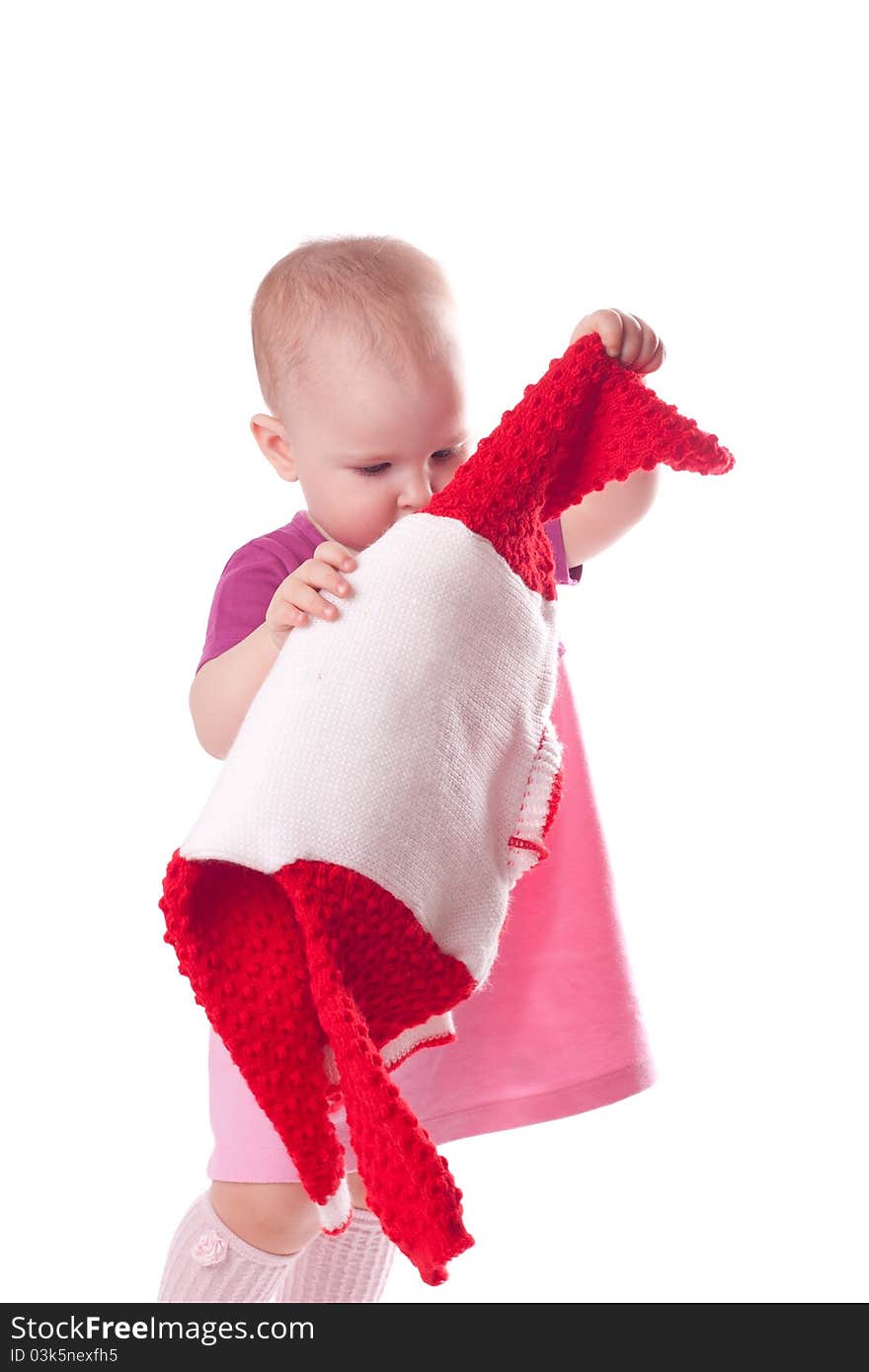 Little girl with wool dress in hands isolated on white