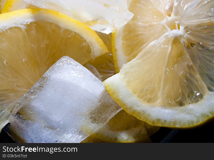 Close-up of slices of lemon with ice cube. Close-up of slices of lemon with ice cube