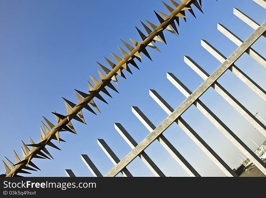 Barbed wire fence at the blue sky